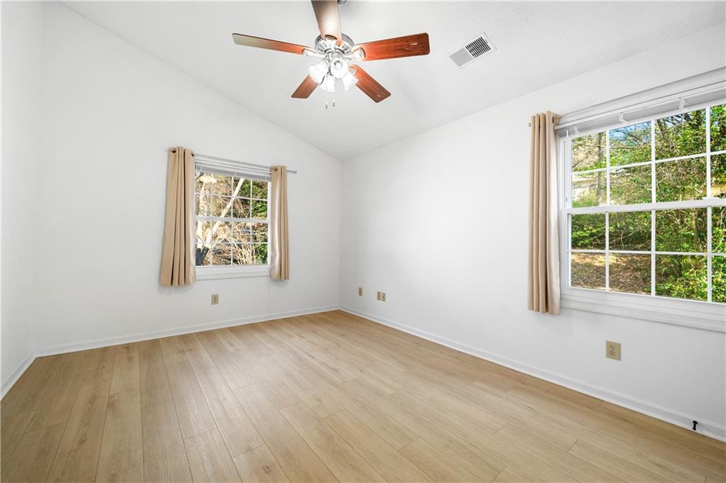 2883 Dresden Square Drive Atlanta, GA 30341 - Photo 18 of 30 an empty room with a window and a ceiling fan