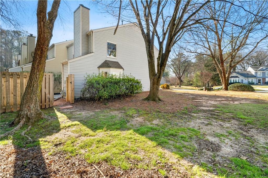 2883 Dresden Square Drive Atlanta, GA 30341 - Photo 25 of 30 a front view of a house with a yard