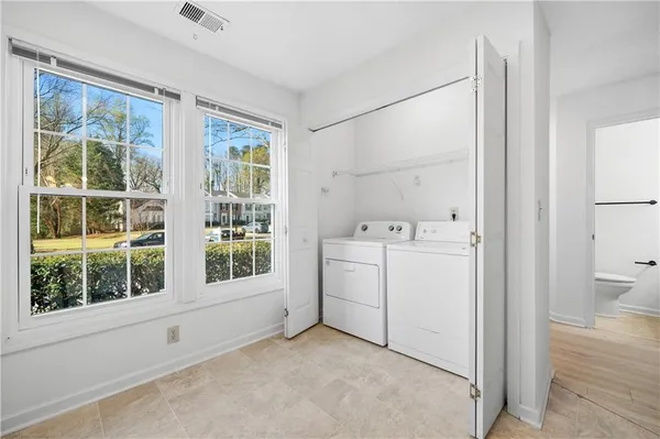 a utility room with dryer and washer