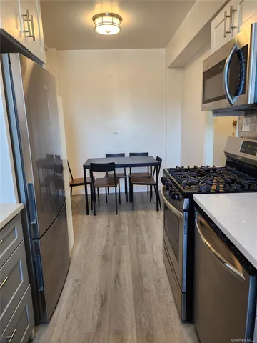 a kitchen with a table and a stove