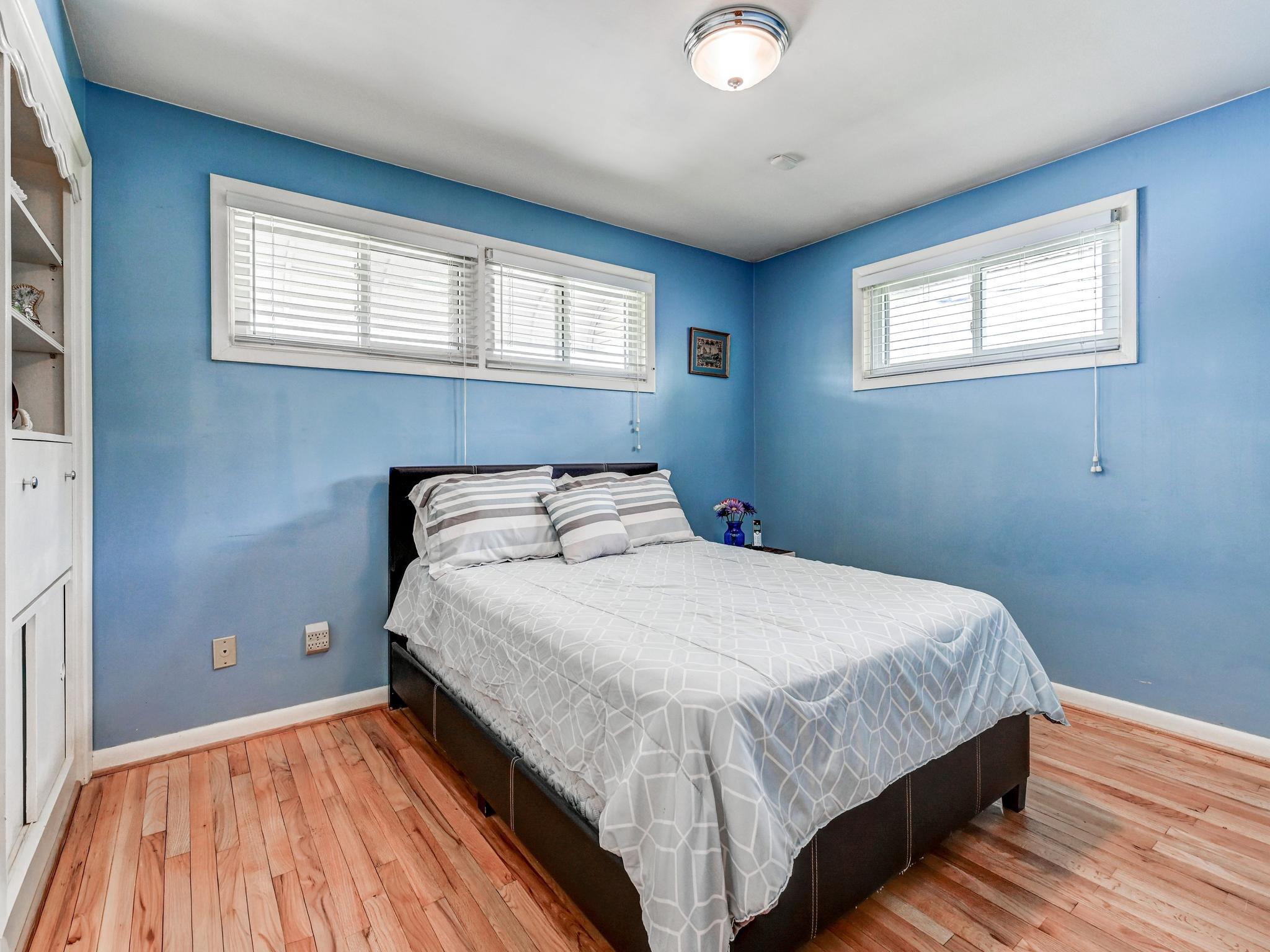 8416 Avery Road Rosedale, MD 21237 - Photo 18 of 35 Serene blue-hued Bedroom #2 with built-in cabinet
