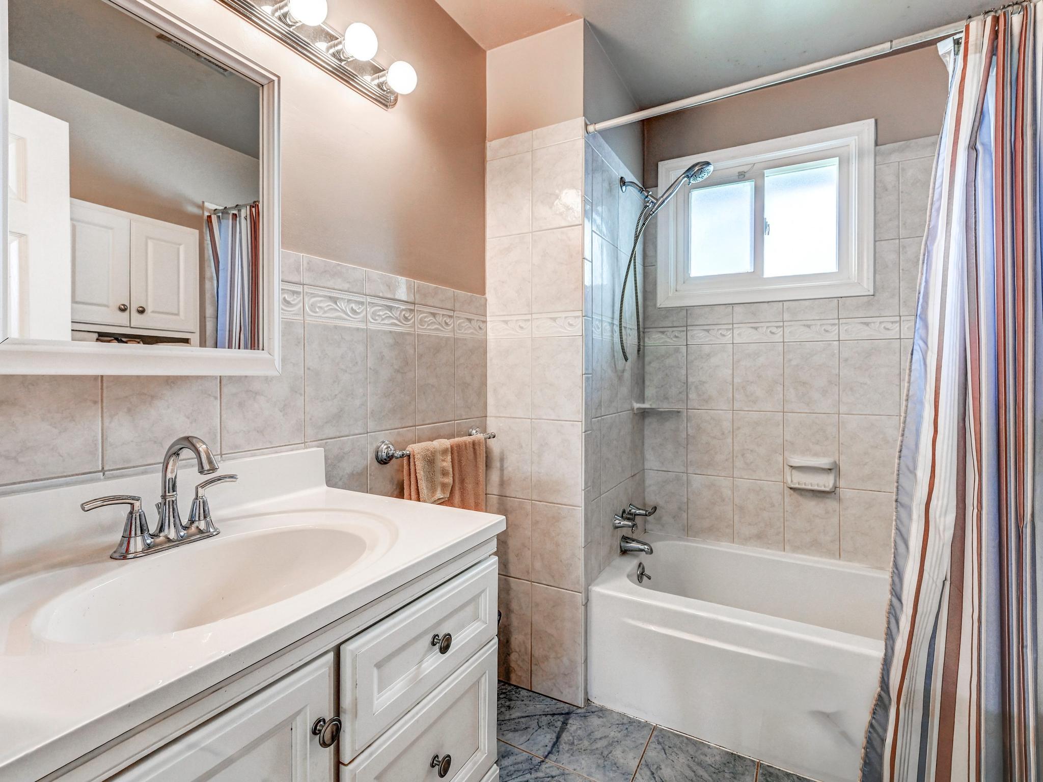 8416 Avery Road Rosedale, MD 21237 - Photo 19 of 35 Updated Hallway Bath w/ceramic tile floor - walls