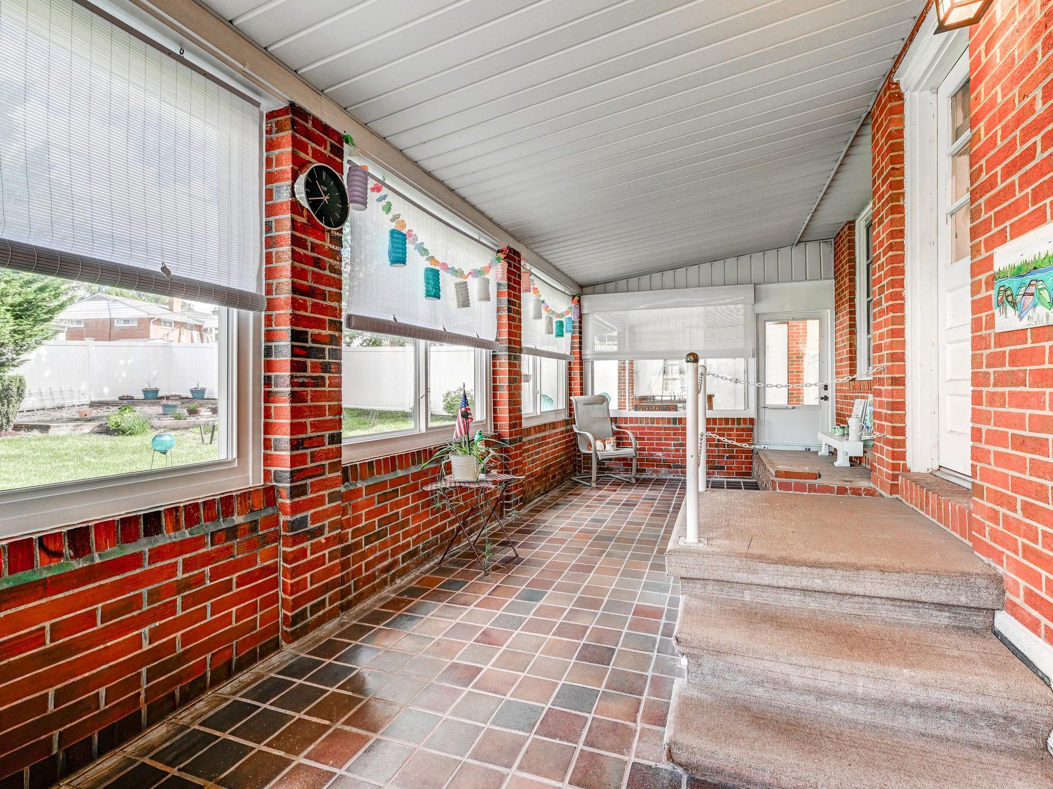 8416 Avery Road Rosedale, MD 21237 - Photo 26 of 35 Sunlit Enclosed Porch Off Kitchen