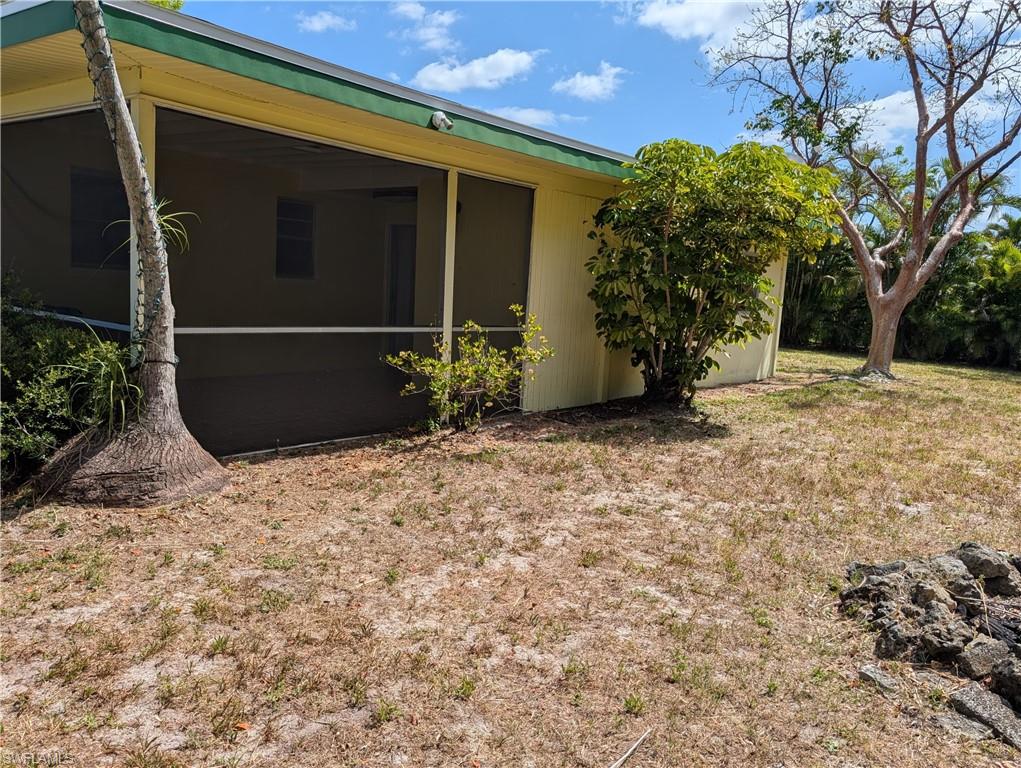 1630 South Fountainhead Road Fort Myers, FL 33919 - Photo 23 of 29 View of home's exterior featuring a sunroom