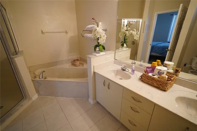 a bathroom with a sink a toilet and shower curtain