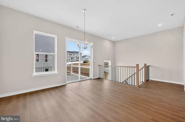 a view of kitchen with refrigerator and window
