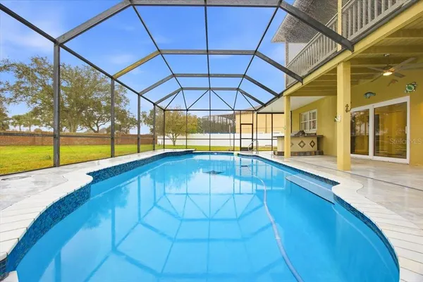 a swimming pool with an outdoor seating