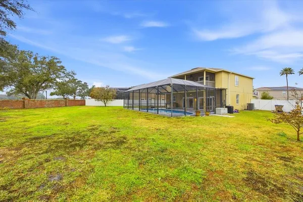 a front view of a house with a big yard