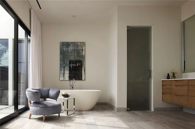 a bathroom with a sink vanity and mirror