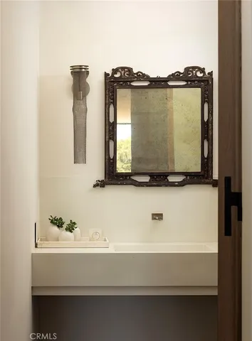 a bedroom with a large bed and lamp