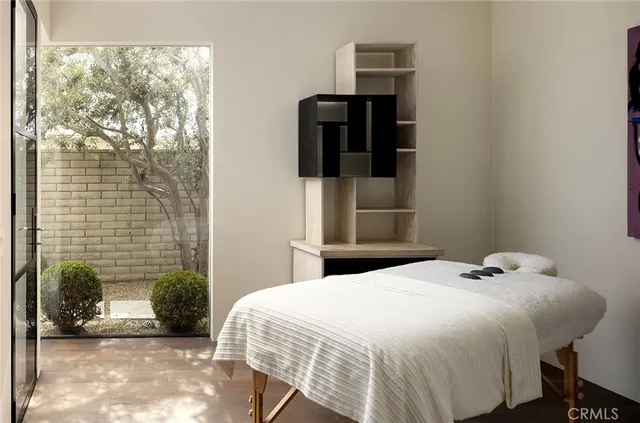 a bathroom with a window and a shower