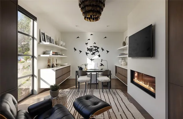 a view of a livingroom with furniture and a fireplace