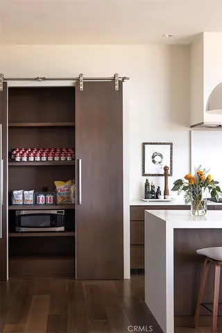 a kitchen with stainless steel appliances a refrigerator and a stove