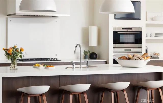 a kitchen with a table and chairs in it