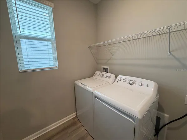 a utility room with dryer and washer