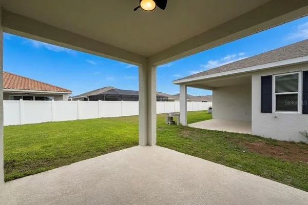 a view of a house with backyard and garden