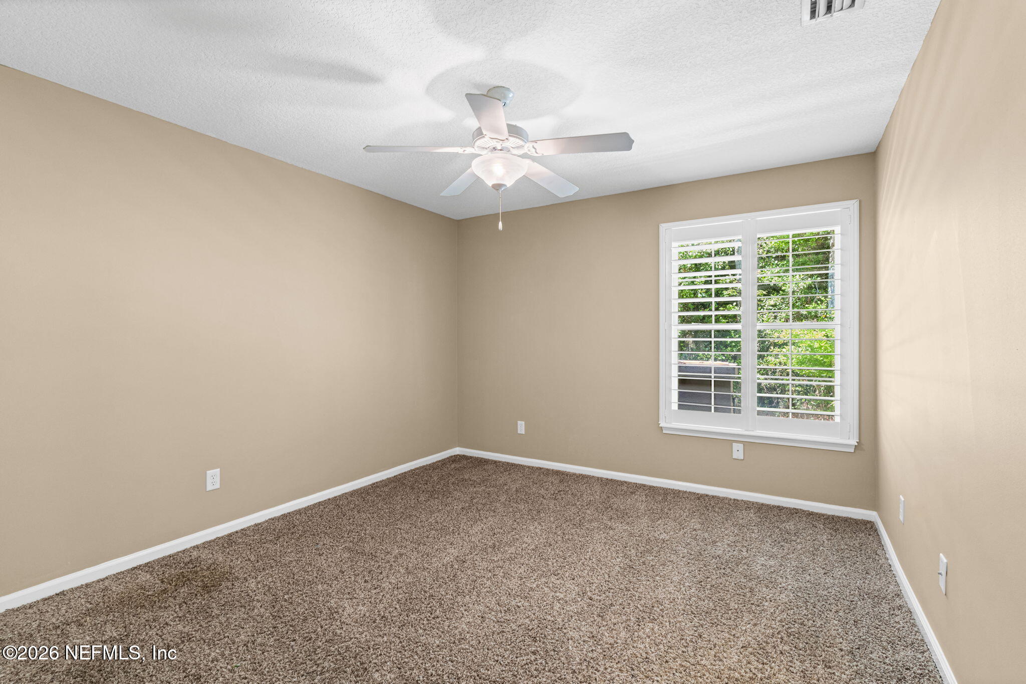 1600 Spring Water Court Fleming Island, FL 32003 - Photo 45 of 85 a view of an empty room with a window