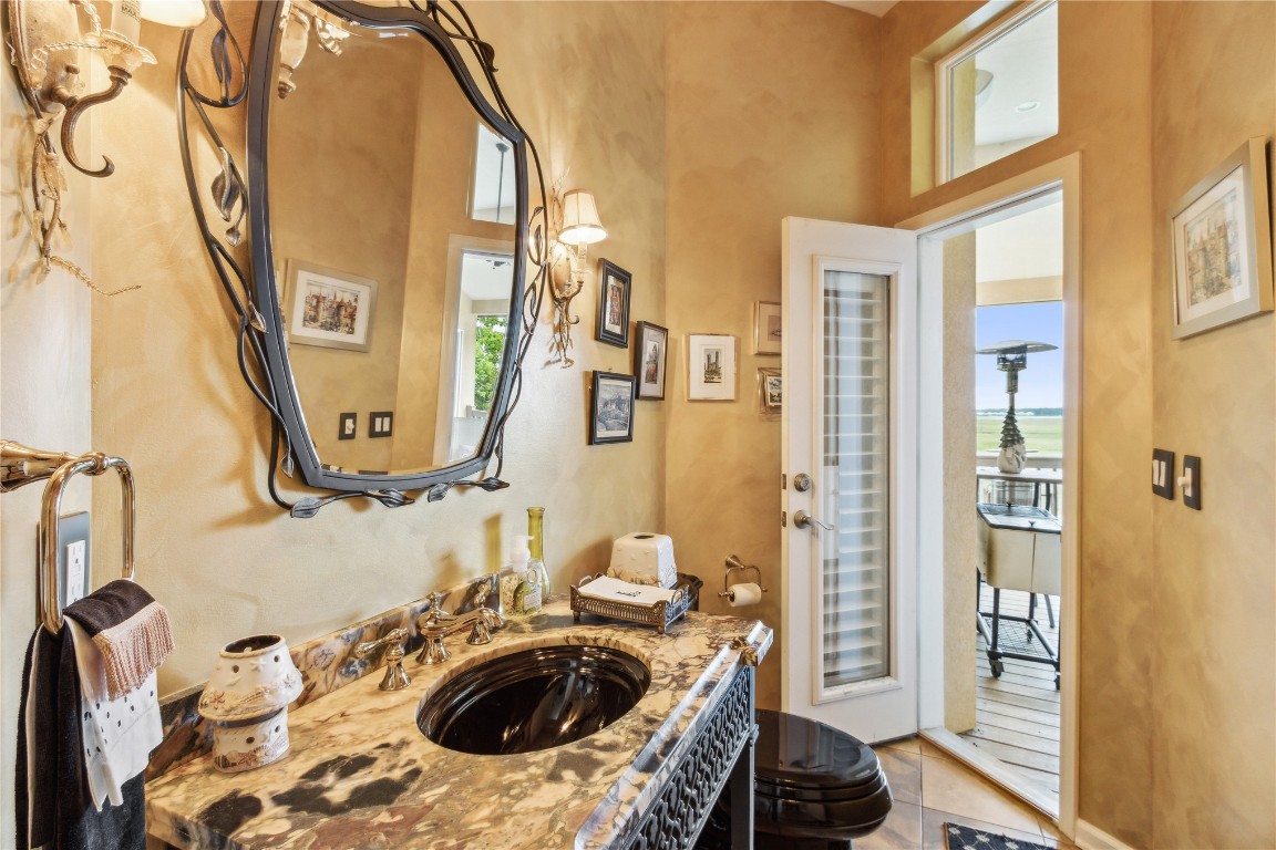 3045 Riverside Drive Fernandina Beach, FL 32034 - Photo 11 of 35 a bathroom with a sink and a mirror
