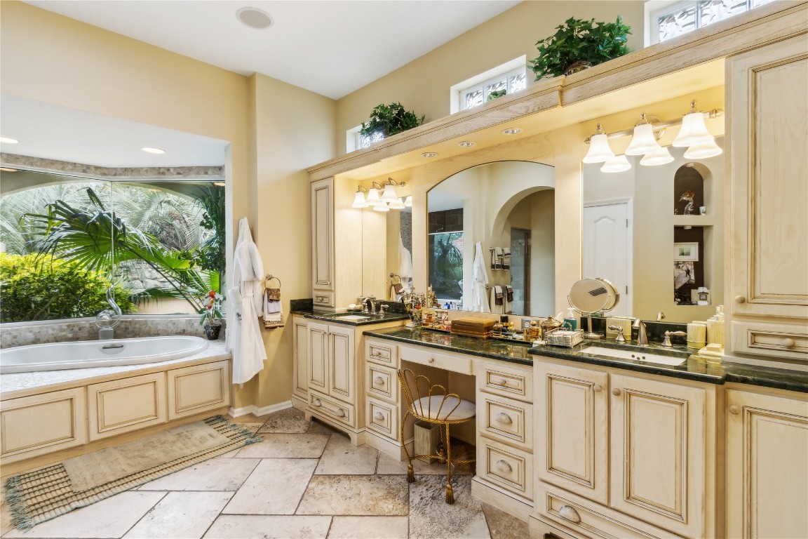 3045 Riverside Drive Fernandina Beach, FL 32034 - Photo 15 of 35 a bathroom with a granite countertop sink and a mirror