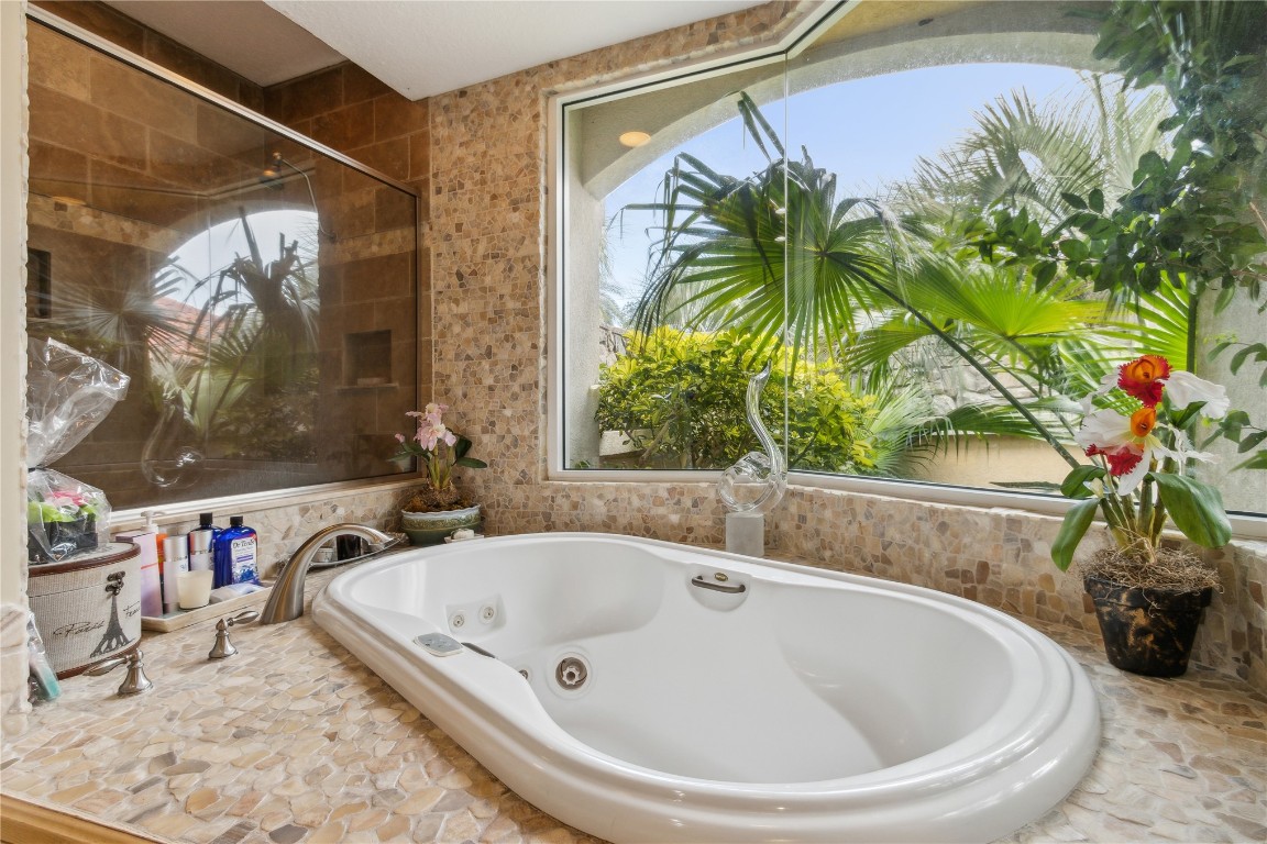 3045 Riverside Drive Fernandina Beach, FL 32034 - Photo 16 of 35 a bathroom with a tub and sink