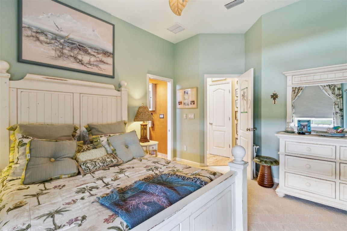 3045 Riverside Drive Fernandina Beach, FL 32034 - Photo 20 of 35 a bedroom with a bed and dresser