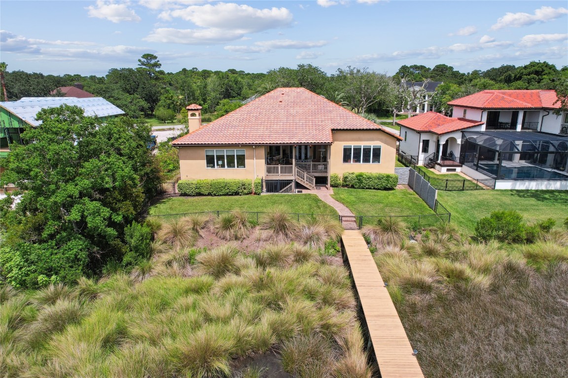 3045 Riverside Drive Fernandina Beach, FL 32034 - Photo 29 of 35 a view of a house with a yard