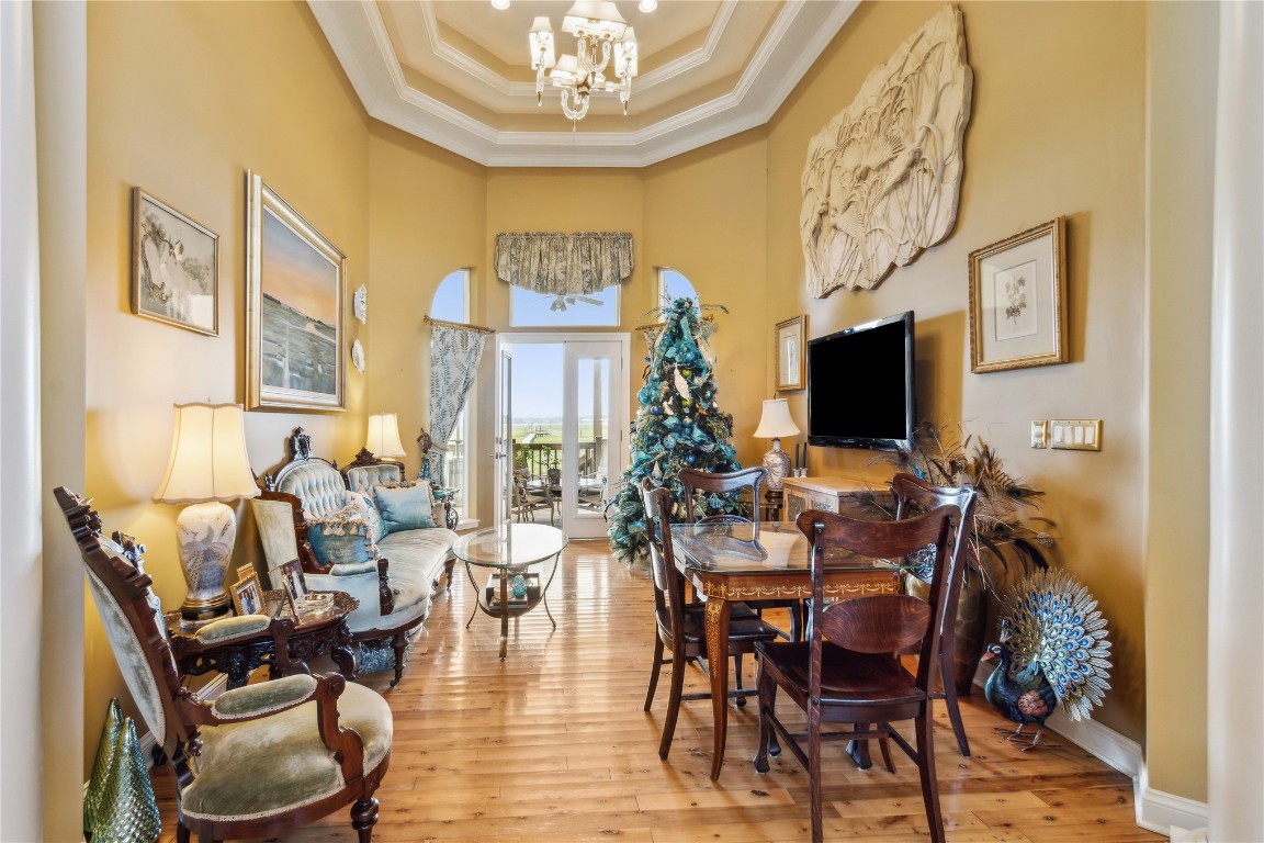 3045 Riverside Drive Fernandina Beach, FL 32034 - Photo 5 of 35 a view of a dining room with furniture wooden floor and a chandelier