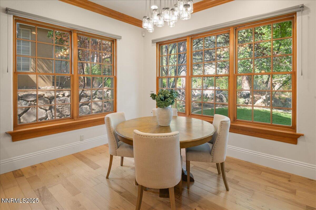 6410 Zermatt Court Reno, NV 89511 - Photo 19 of 52 a view of a dining room with furniture window and wooden floor