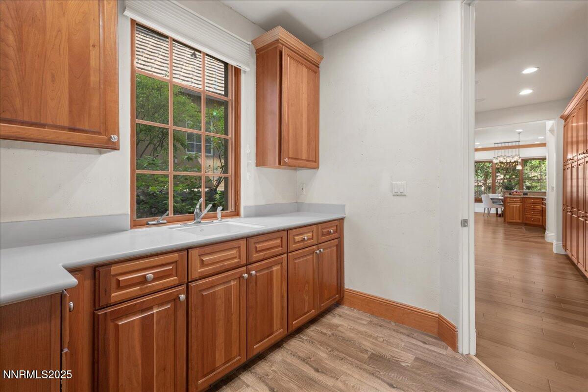 6410 Zermatt Court Reno, NV 89511 - Photo 20 of 52 an empty room with wooden floor and windows