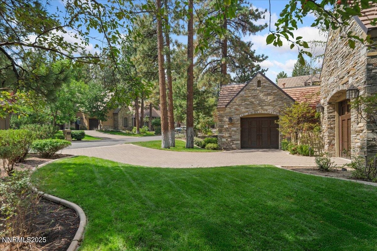 6410 Zermatt Court Reno, NV 89511 - Photo 2 of 52 a view of a garden with large tree