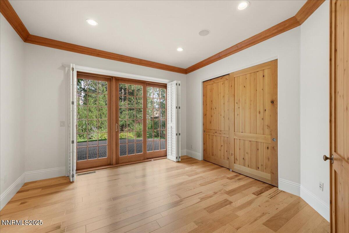 6410 Zermatt Court Reno, NV 89511 - Photo 23 of 52 a view of an empty room with wooden floor and a window