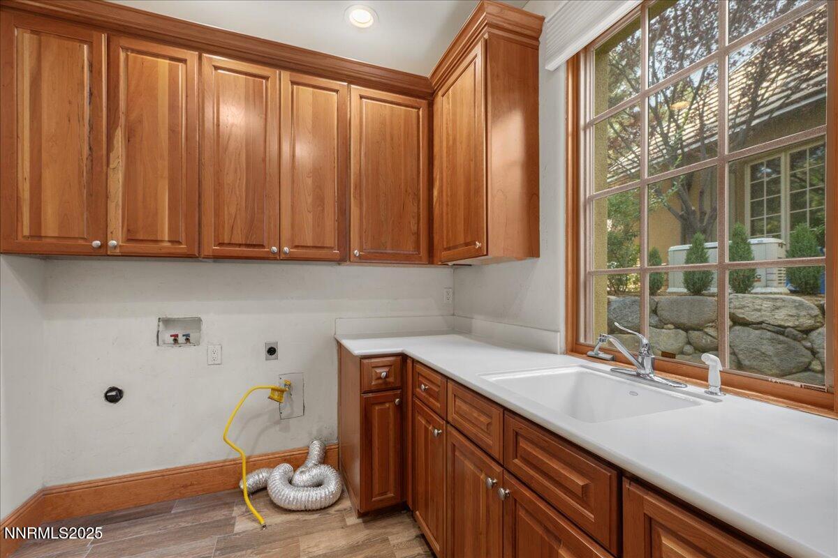 6410 Zermatt Court Reno, NV 89511 - Photo 25 of 52 a kitchen with a sink and cabinets