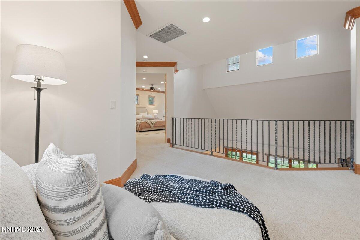 6410 Zermatt Court Reno, NV 89511 - Photo 28 of 52 a bedroom with a bed and a lamp