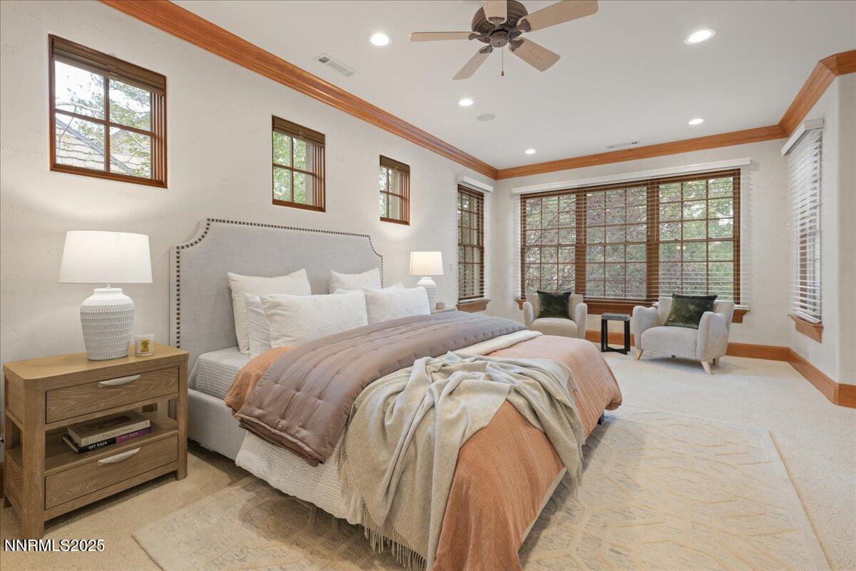 6410 Zermatt Court Reno, NV 89511 - Photo 30 of 52 a spacious bedroom with a bed and a couch