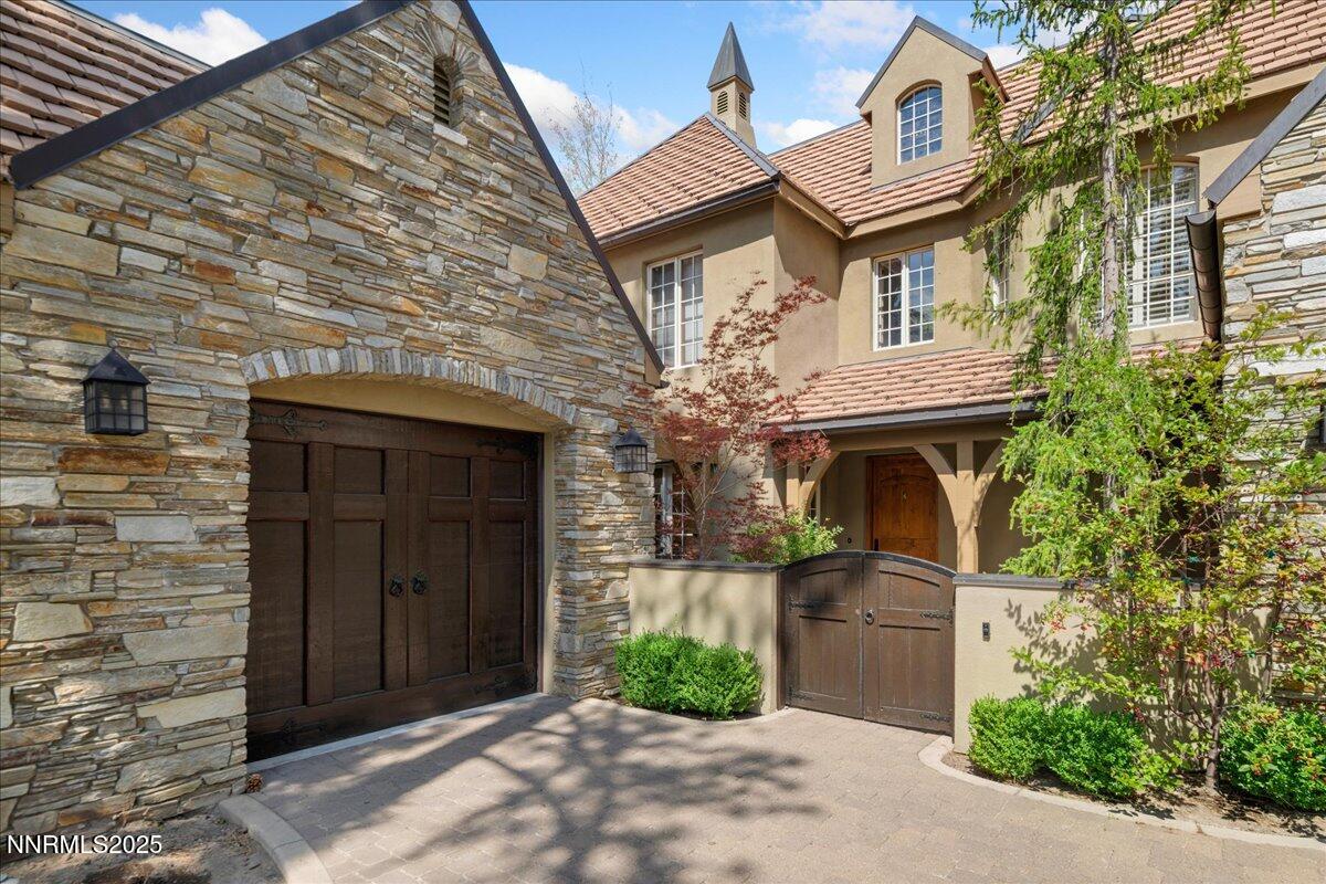 6410 Zermatt Court Reno, NV 89511 - Photo 3 of 52 a front view of a house with garden