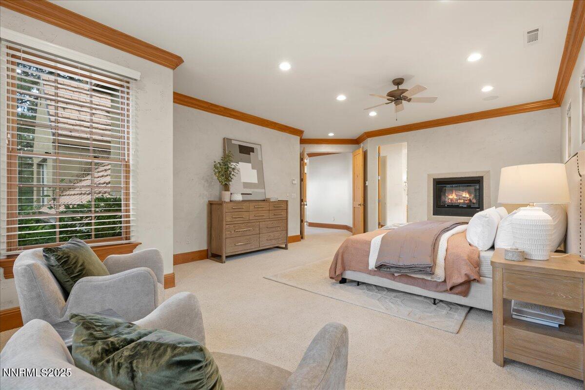 6410 Zermatt Court Reno, NV 89511 - Photo 31 of 52 a spacious bedroom with a bed and window