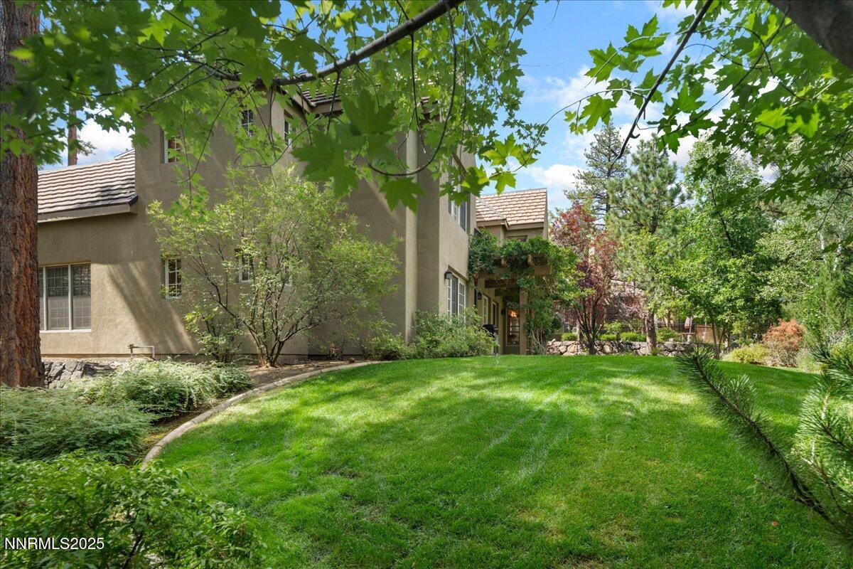 6410 Zermatt Court Reno, NV 89511 - Photo 49 of 52 a view of a backyard with large trees