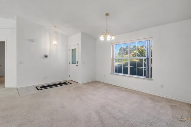 a spacious bedroom with a bed and a couch