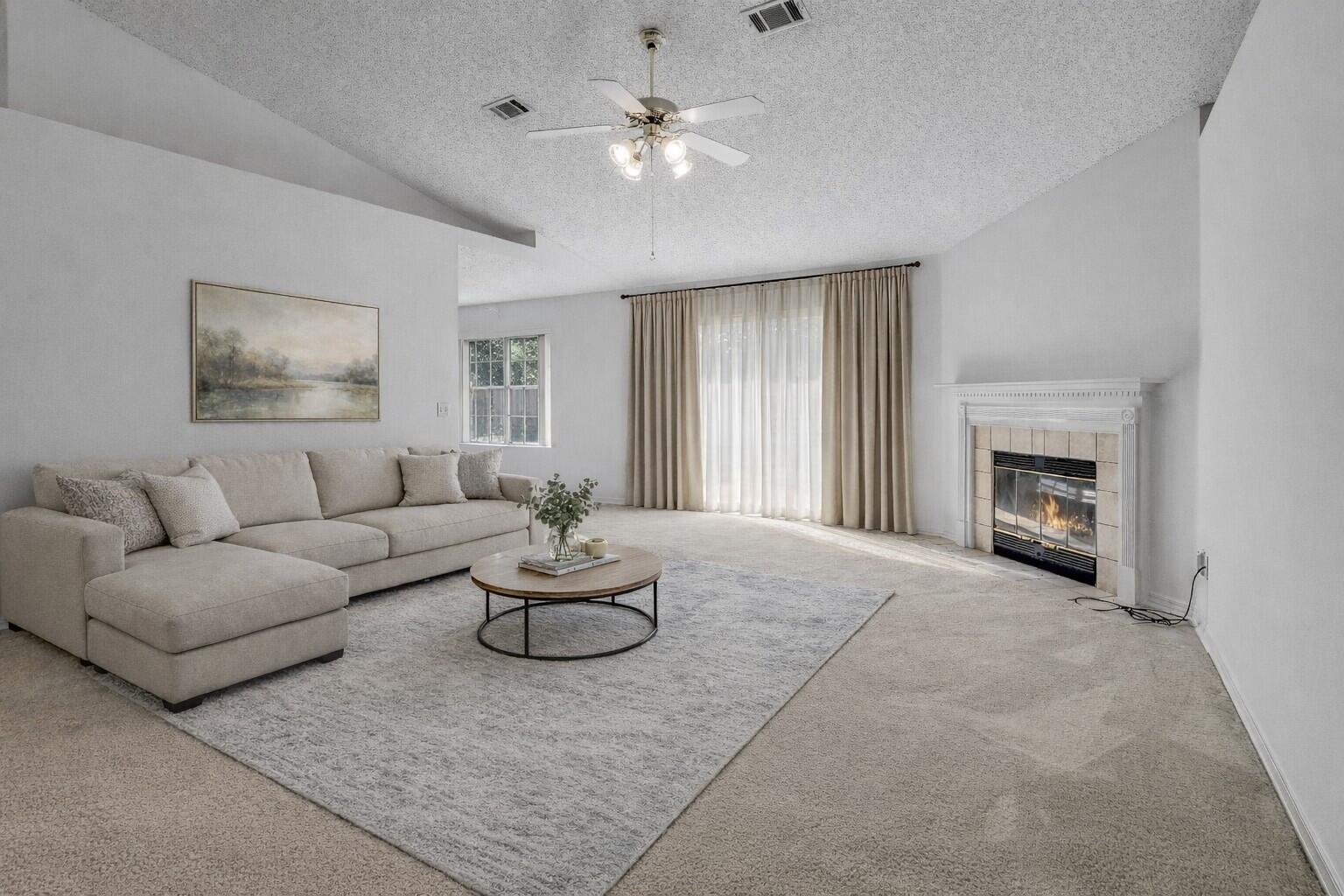 2095 Jessica Way Navarre, FL 32566 - Photo 18 of 52 a living room with furniture and a fireplace