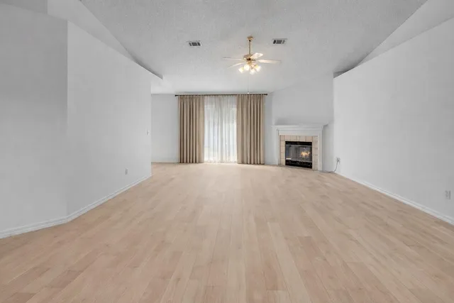 an empty room with a fan