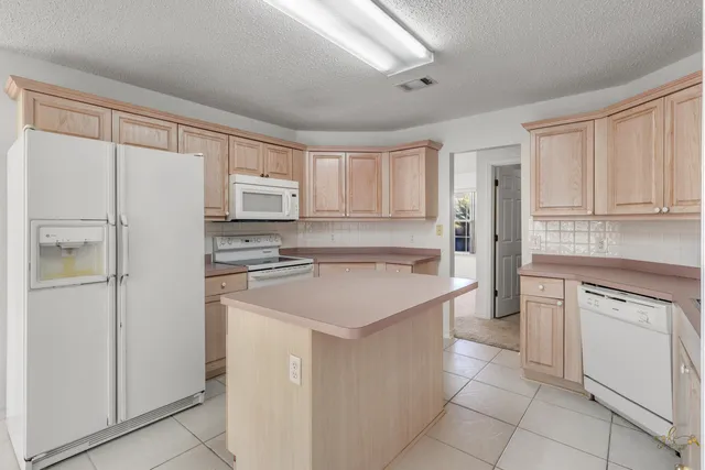 a swimming pool view with a garden space