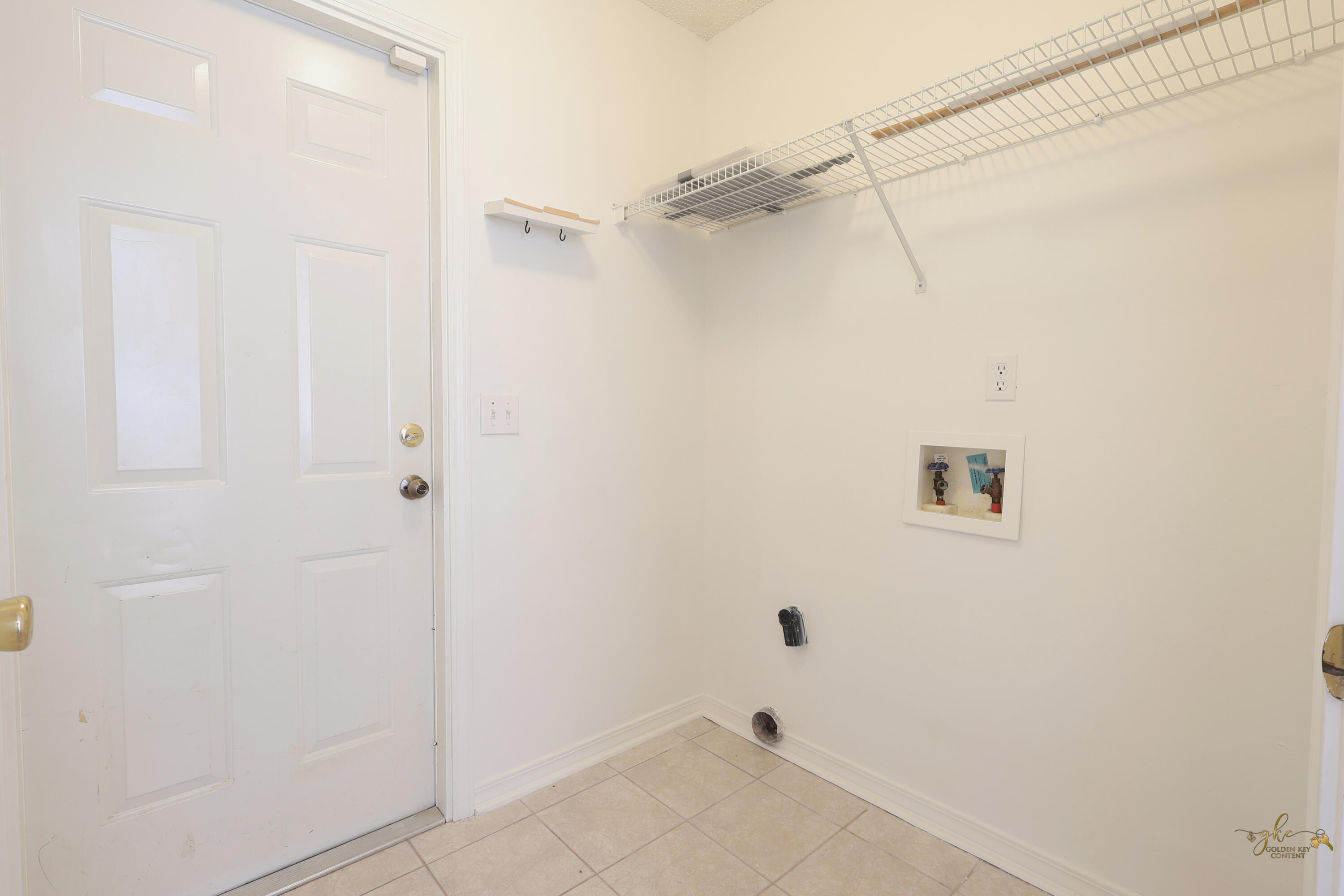 2095 Jessica Way Navarre, FL 32566 - Photo 26 of 52 a view of a room with racks on the wall