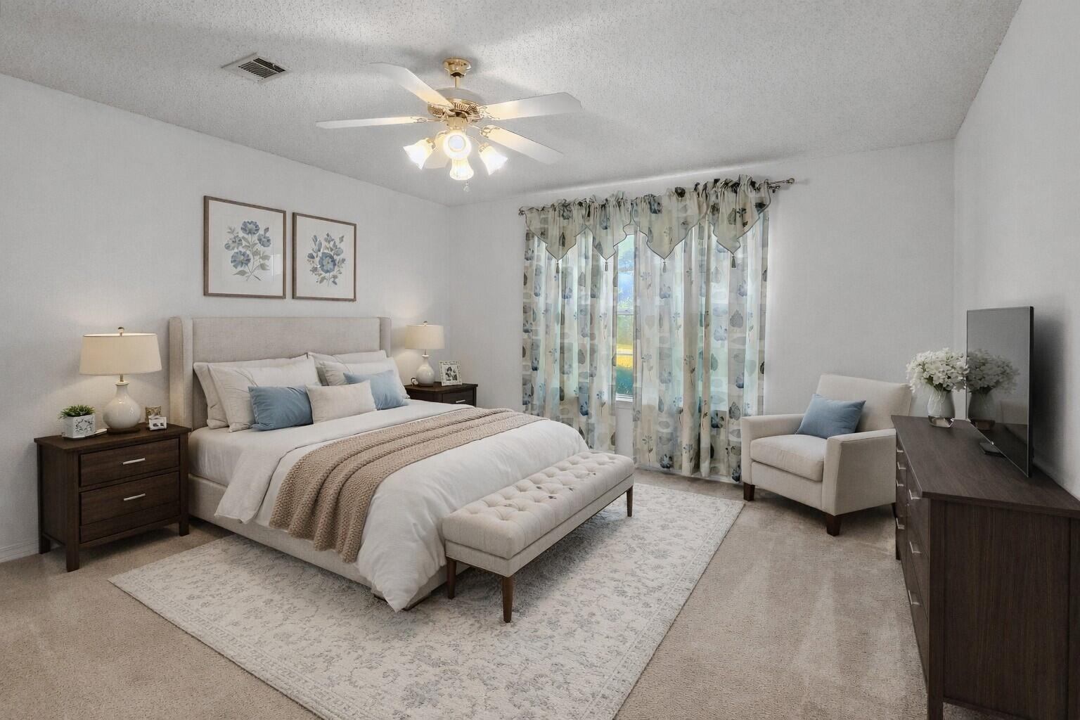 2095 Jessica Way Navarre, FL 32566 - Photo 30 of 52 a spacious bedroom with a bed and a couch
