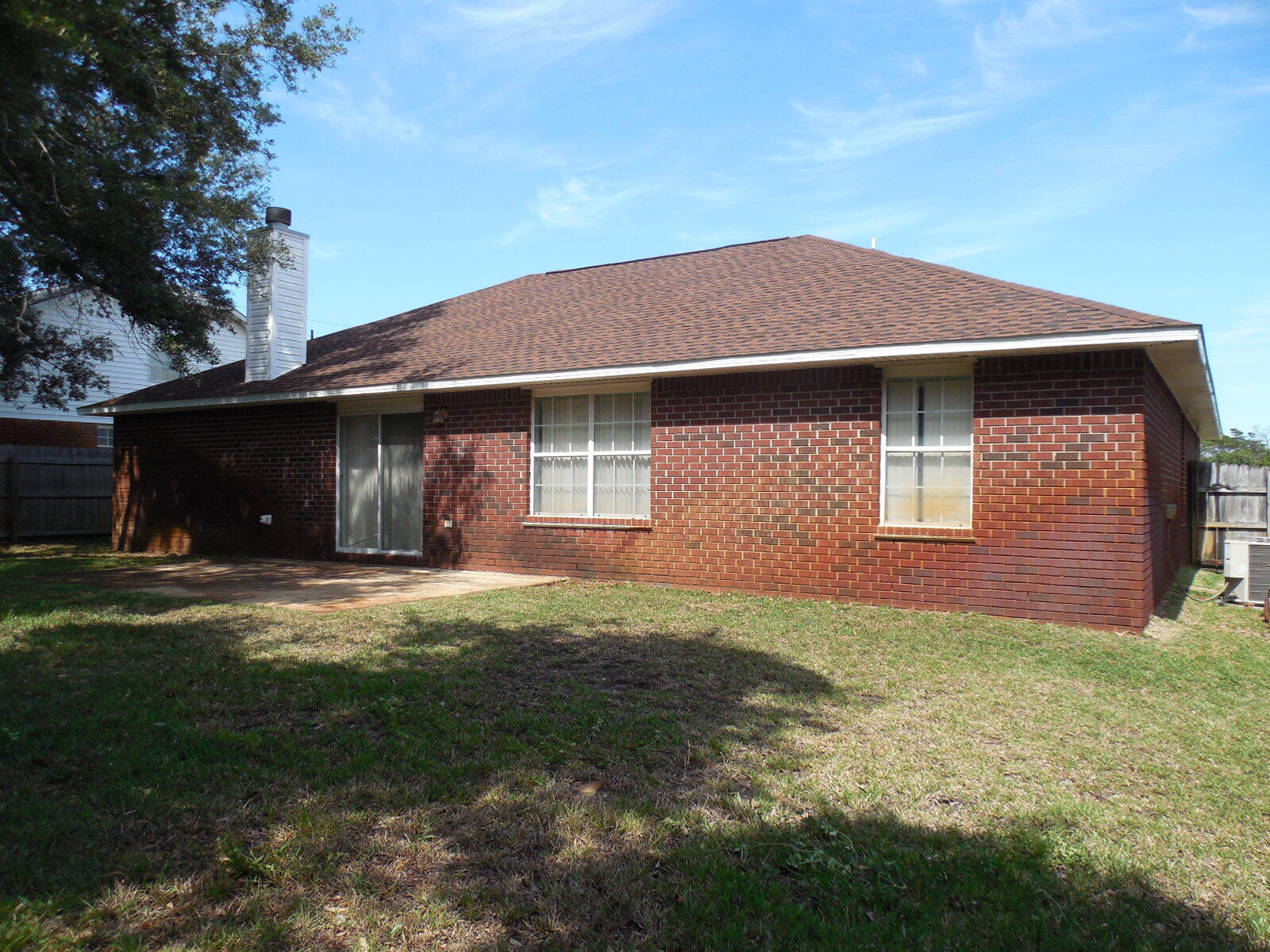 2095 Jessica Way Navarre, FL 32566 - Photo 5 of 52 a front view of a house with a yard and garage