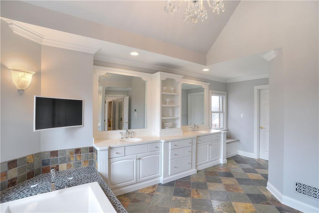 32 Newgate Road Pittsburgh, PA 15202 - Photo 14 of 25 Renovated master bath with ample shelving, cabinetry and a large walk-in closet.