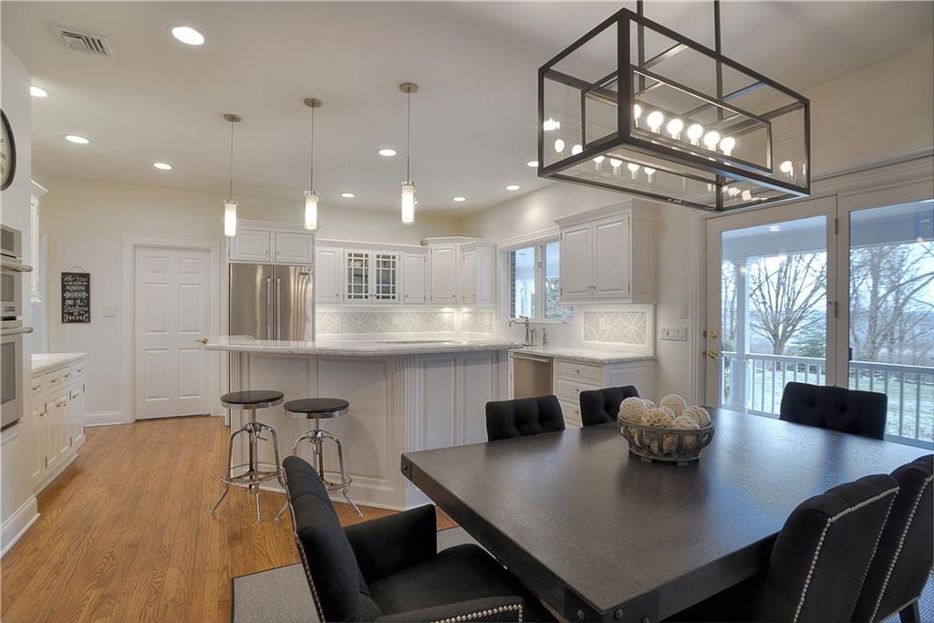 32 Newgate Road Pittsburgh, PA 15202 - Photo 5 of 25 Everyday life is enhanced by a Breakfast room that opens to a large covered deck. A large laundry room off of the kitchen has ample storage, another refrigerator as well its own security system ideal for dog walkers to come and go.