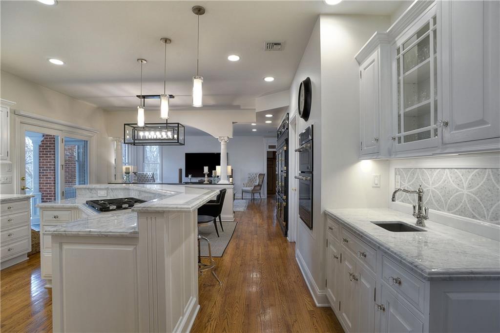 32 Newgate Road Pittsburgh, PA 15202 - Photo 7 of 25 Beautifully attired, the kitchen boasts Carrera marble countertops and mosaic backsplash that was hand carved on site.