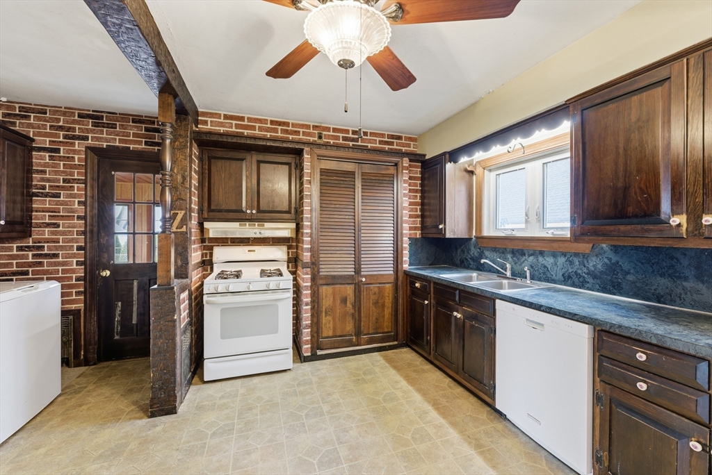 171 Maple Street East Longmeadow, MA 01028 - Photo 12 of 42 a kitchen with a stove sink and refrigerator