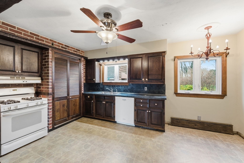 171 Maple Street East Longmeadow, MA 01028 - Photo 14 of 42 a kitchen with stainless steel appliances granite countertop a stove and a sink