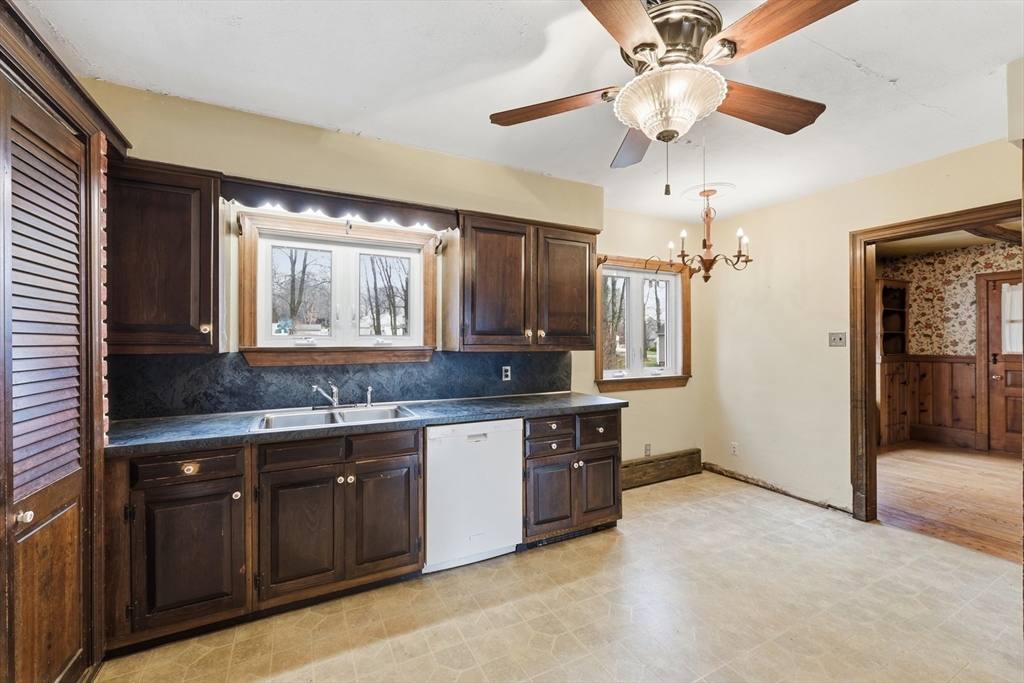 171 Maple Street East Longmeadow, MA 01028 - Photo 15 of 42 a large kitchen with a sink and dishwasher a refrigerator with wooden cabinets